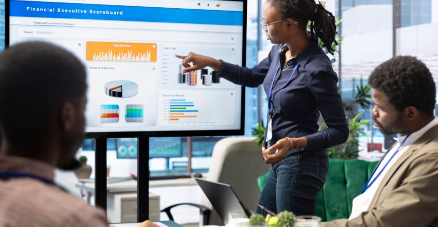 Advisory board members and team leaders gathering to review project outcomes, discuss resource allocation to ensure objectives achievement. Diverse business associates in a meeting.