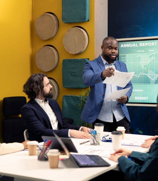 Corporate employees reviewing transactional info to improve customer satisfaction, expanding on the market. General director and his team making critical decisions regarding activity development.