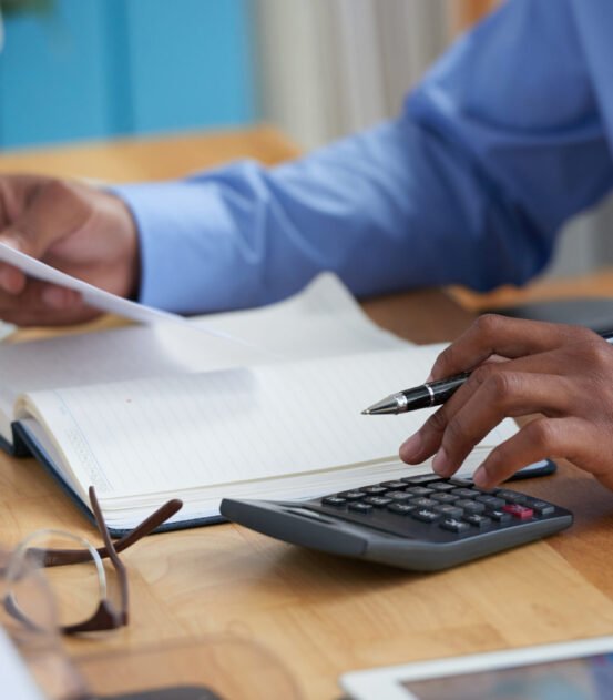 Close-up image of financial managers working with reports