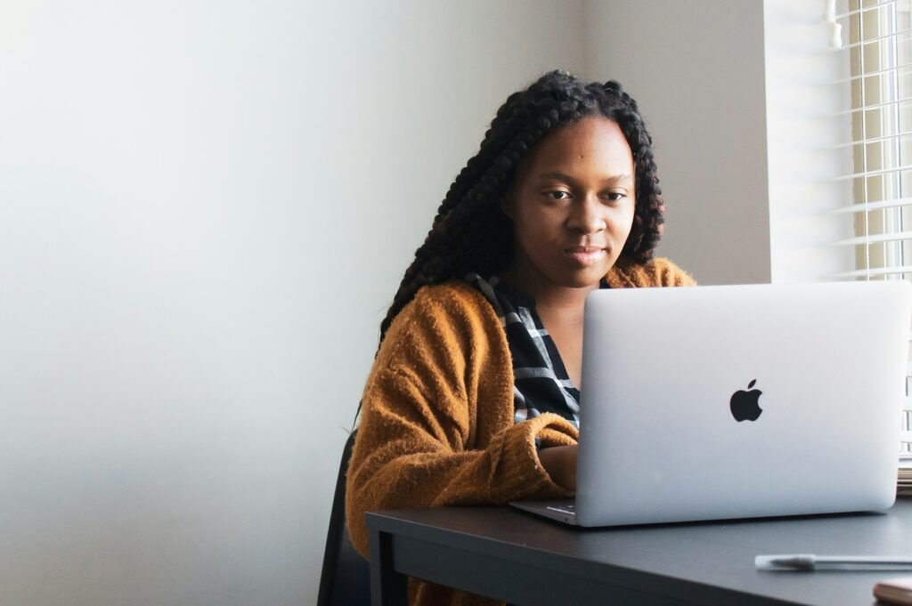 A professional learning online on her laptop